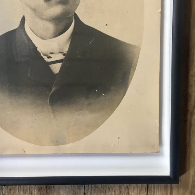 Charming portrait of a turn of the 20th century gentleman wearing a striped cravat. Photo is newly framed and "floating"...