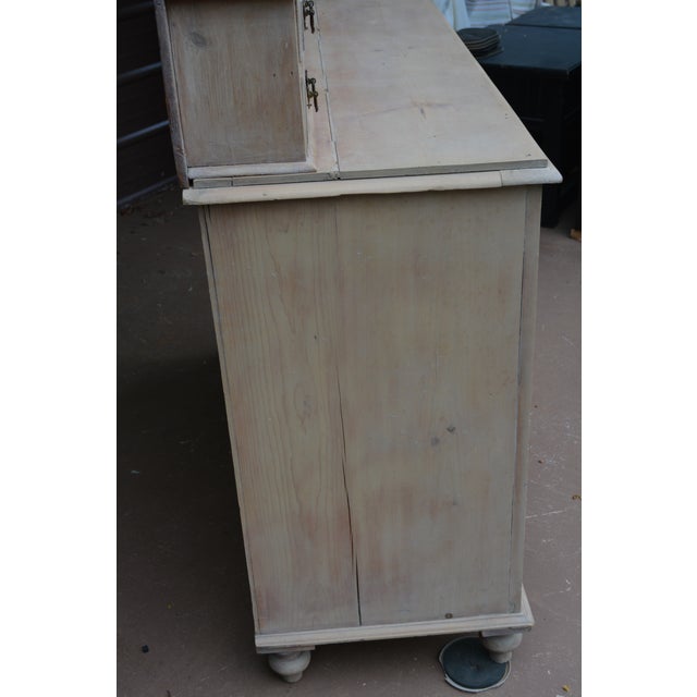 This is a neat looking pine sideboard/dresser. Possibly handmade? Not overly heavy. Brassy hardware & bun like feet. The...
