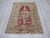 Vintage distressed rug from the Oushak region of Turkey. Approximately 50-60 years old. In good condition.