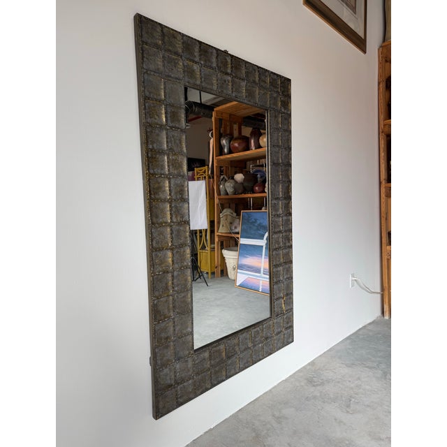 Striking vintage Brutalist wall mirror by Uttermost. The substantial frame is crafted from hand-forged metal panels...