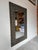Striking vintage Brutalist wall mirror by Uttermost. The substantial frame is crafted from hand-forged metal panels...