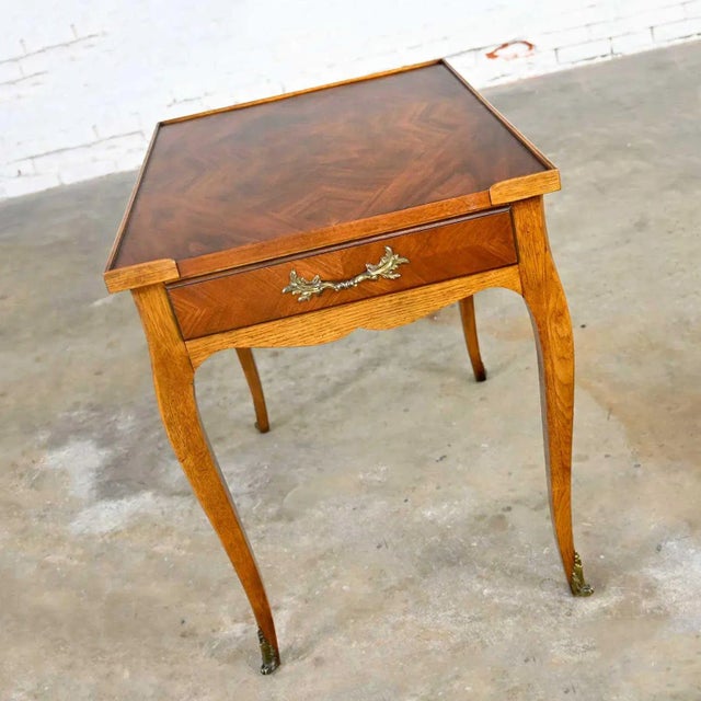 Wonderful vintage Baker French Louis XV style end table with brass ormalu details. Beautiful condition, keeping in mind...