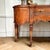 This exceptional Louis XV style sideboard features richly figured book matched mahogany veneers with mirrored chevron...