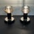 A pair of vintage "Saturne" table lamps, so named for their overlapping disc lampshades reminiscent of the rings of the...