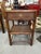 20th Century British Colonial style cane rattan side table nightstand to mix into your space. Made exclusively for...