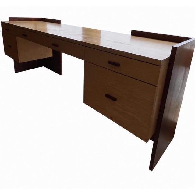 Custom-designed and made by Poliform (R&D) in 2006, this solid-wood desk has a clean, architectural presence. The warm...