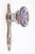 Art Deco style round shaped purple glass door knob with a nickel plated brass back plate. The original mounting screws are...