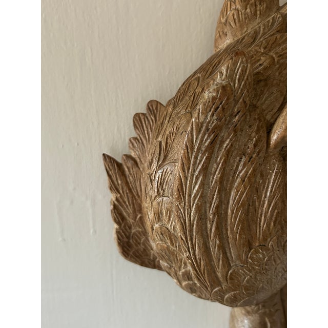 A beautifully detailed vintage hand carved wooden wall sculpture depicting a pair of ducks in rich, warm toned hardwood....