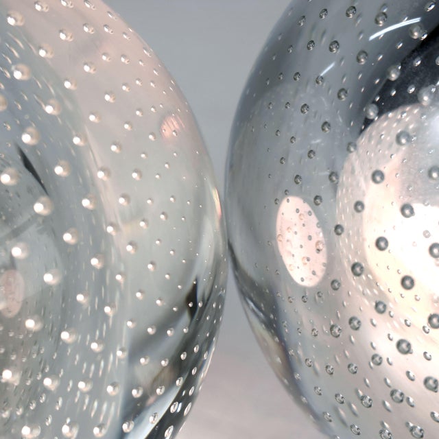 Designed and manufactured in Italy in the 1960s, this rare pair of wall sconces by Gino Sarfatti and Archimede Seguso for...