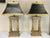 Striking pair of French Empire style bouillotte lamps from the late 20th century. They are made of heavy wood in a gold...