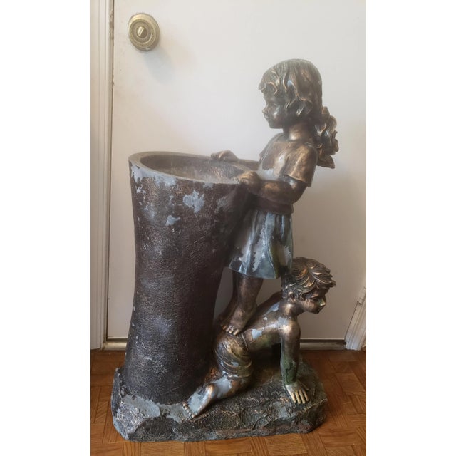 Vintage boy and girl water fountain statue. Boy & Girl Water Fountain Statue. Made out of resin and fiberglass materiel...