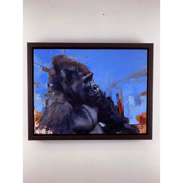 The artwork features a contemplative gorilla set against a vibrant blue sky, evoking a sense of introspection and...