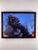The artwork features a contemplative gorilla set against a vibrant blue sky, evoking a sense of introspection and...