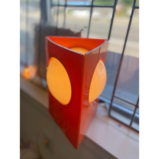 A rare and visually compelling table lamp likely from the 1970s, exemplifying bold Space Age design. This sculptural piece...