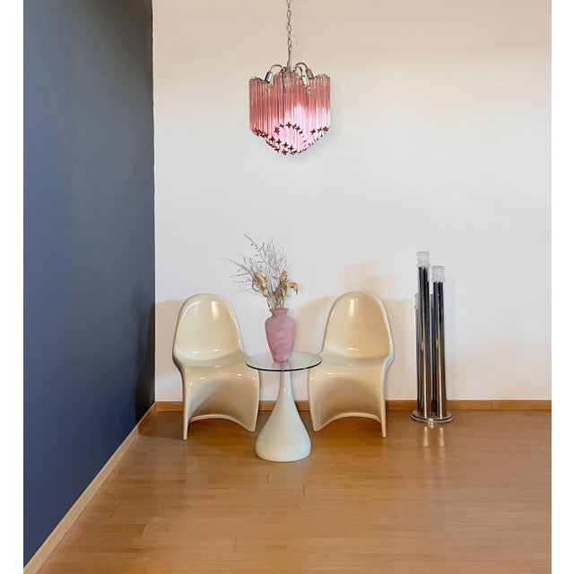 A magnificent murano glass unique chandelier, spiral shape, very elegant, 60 pink quadriedri on nickel metal frame. This...