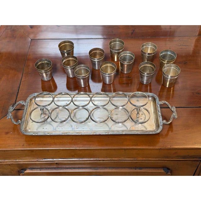 Design Plus Gallery presents the Vintage Silverplate Cordial Set with Serving Tray. A 13-piece service comprising twelve...
