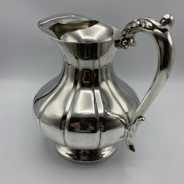 Here is a made in The U .S., Sheffield water/ice tea pitcher, with a built in ice stop when pouring. This Sheffield...