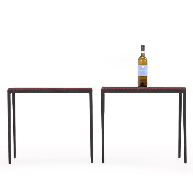 A sophisticated pair of handcrafted side tables inspired by the refined minimalism of Jean-Michel Frank. Each table...