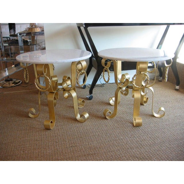 These fantastic pair of 1960's vintage Italian real gold leaf over iron end /side tables have a ever so slight slight red...