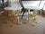 These fantastic pair of 1960's vintage Italian real gold leaf over iron end /side tables have a ever so slight slight red...