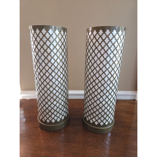 Add a warm, luminous glow to your space with this stunning pair of vintage Hollywood Regency table lamps. Featuring...