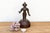 An exceptional devotional casting showcasing an authoritative, linear posture, cross-hatched ritual vestments, and a...