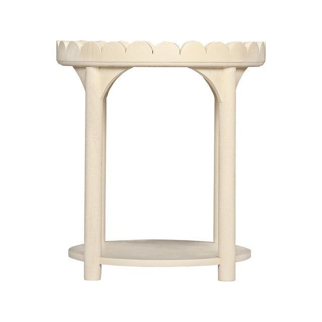 The Scalloped Round Side Table Crafted from natural wood, this scalloped accent tables add a joyful pop of color and...