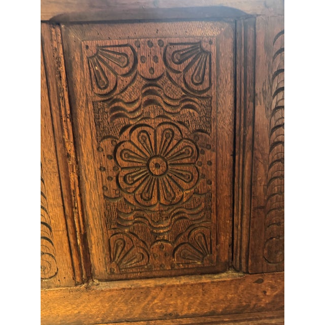 A remarkable 18th century Dutch tuugkist blanket chest from the Twente region, crafted in solid oak and richly adorned...