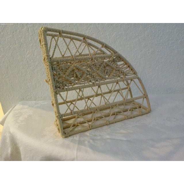 Chic wire and cream-shaded macrame magazine holder. Nicely weaved.
