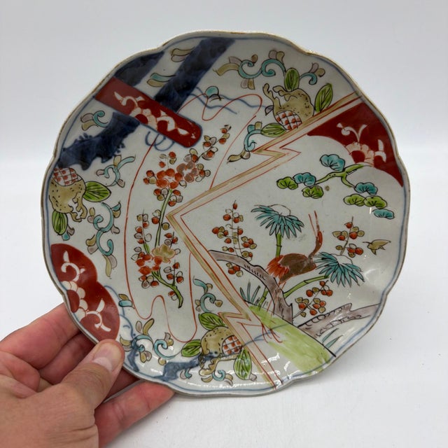 19th Century Japanese Imari Porcelain Plate with Crane & Pine Motifs - 8.5" An authentic 19th-century Japanese Imari...