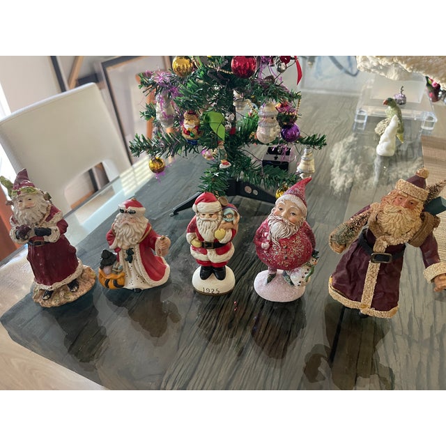 Set if 5 mid 30 th c Santa Claus figurines in porcelain and resin.