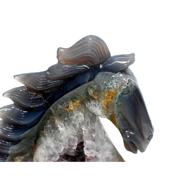 A stunning all natural agate horse bust. The sculpture preserved the original characters of the gem stone, showing the...