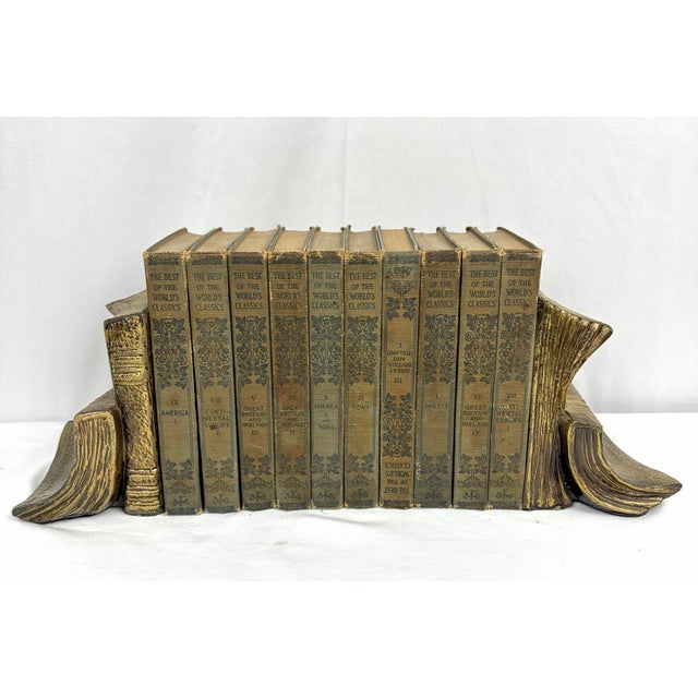 A refined pair of mid-century solid brass bookends designed in the form of classic bound volumes, produced by Art Brass...