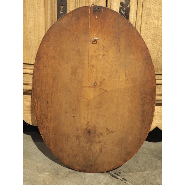 Hand-carved in France during the 1800s, this oval game plaque has amazing detail that includes a textured bark trompe...