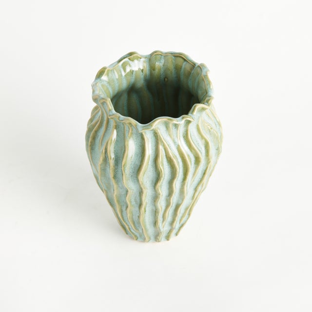 With a sculpted body and thicklyapplied reactive glaze, this sculptural pot is a work of art. The handfinished details...