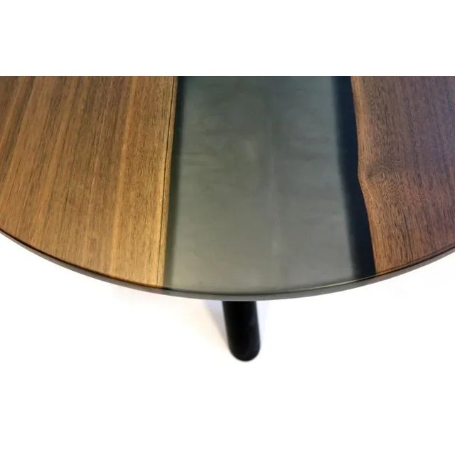 Saturn coffee table by kv design one of a kind dimensions: ø 80 x h 63 cm. Materials: walnut, metal, and epoxy.