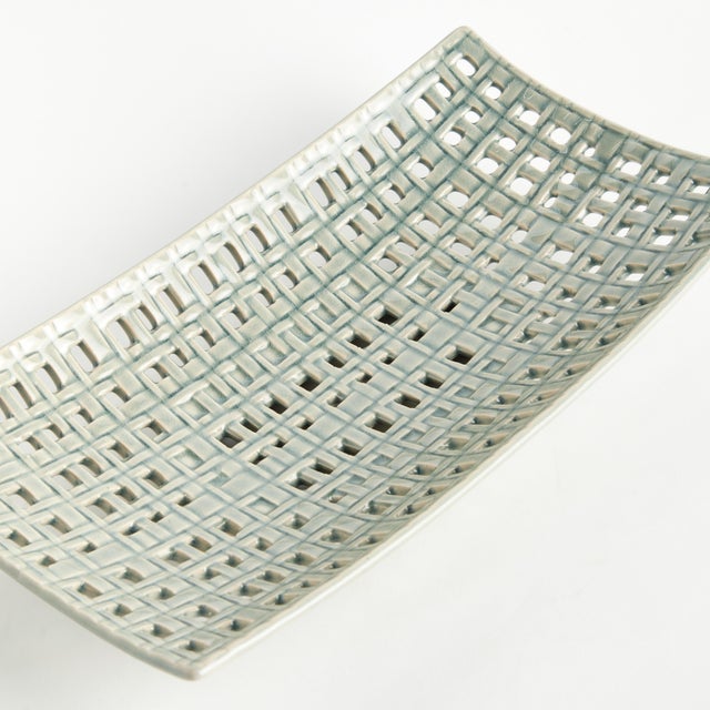 This tray is gorgeous as a centerpiece, or to hold a large vase or sculpture. The , open weave, stoneware design is...