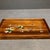 This elegant rectangular serving tray is handcrafted from warm rosewood with raised edge framing. The surface features...