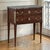 A 19th century French Directoire mahogany commode in the Louis XVI taste, crowned by its original gray marble top with...