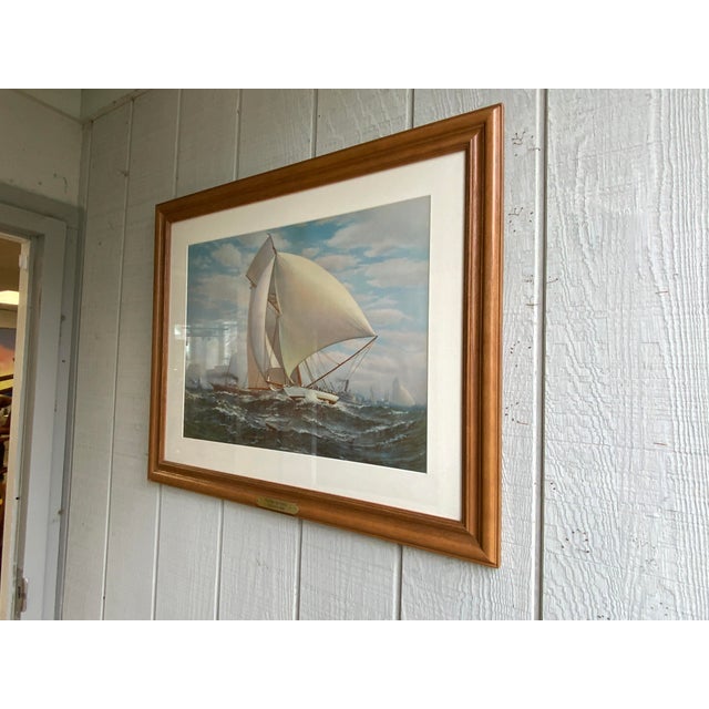 Late 20th century reproduction print of “The Flying Defense” Framed and mated under glass, with metal plaque of ships name.