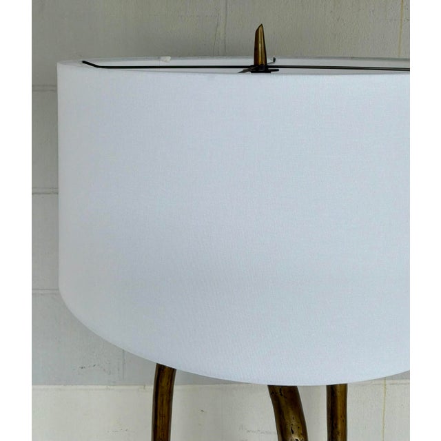 Original retail $1575, stylish Revelation Modern Antique Brass Wish Bone Tripod Floor Lamp, white fabric shade, showroom...