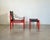 1970s armchair with stool designed by Erik Wørts, lacquered wood and faux leather frame, stool size h.39x62x41 cm. This...