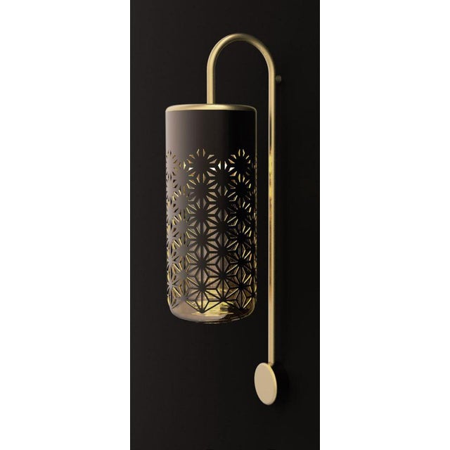 Antares Wall Sconce in Bronze and Brass by Aggiolight. Dimensions: D 15 x H 35 cm. Materials: Dark Antique Bronze, Brushed...
