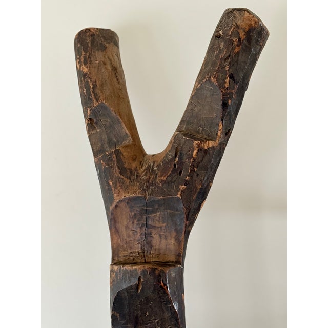 A wooden ladder hewn from a single tree used by the Dogon people to access elevated grain bins. A large sturdy example...