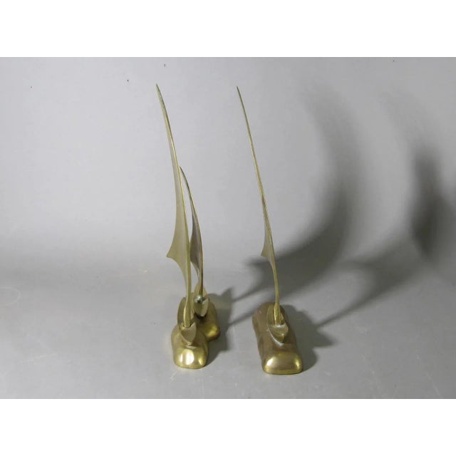 Set of brass sailboats all with the wind in their sails. Made in the 1960s.