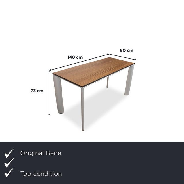 The rectangular tabletop in warm brown rests on four slender, tapered aluminum legs. This exposed aluminum gives the table...