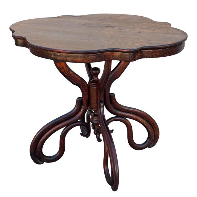 Rare late Victorian polished oak scrolling occasional table by Gebrüder Thonet features a distinctive four-lobed,...