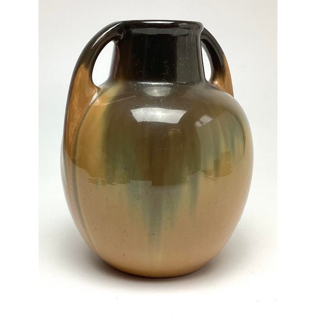A beautiful Arts & Crafts period Fulper Pottery vase featuring a rich, glossy butterscotch flambé glaze with warm tonal...