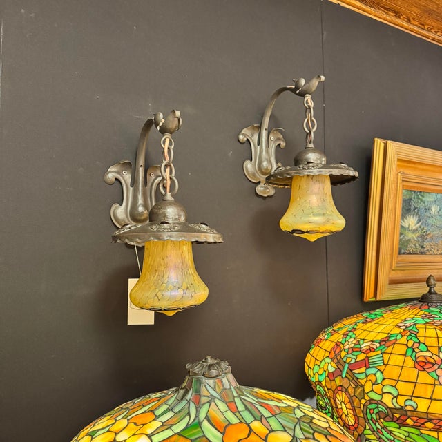 Amazing craftsmanship and details on this pair of early 1900’s bronze Austrian sconces with glass shades attributed to...