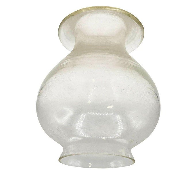 This vintage western-style clear glass oil lamp Hurricane Shade has a smooth, curved design with a softly diffused finish....